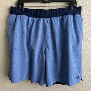 Nike 7” blue Dri-fit athletic shorts with navy trim‎